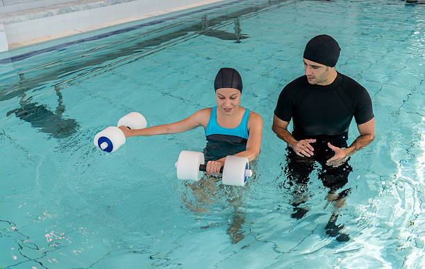istock Woman doing physical therapy in the water 512978824