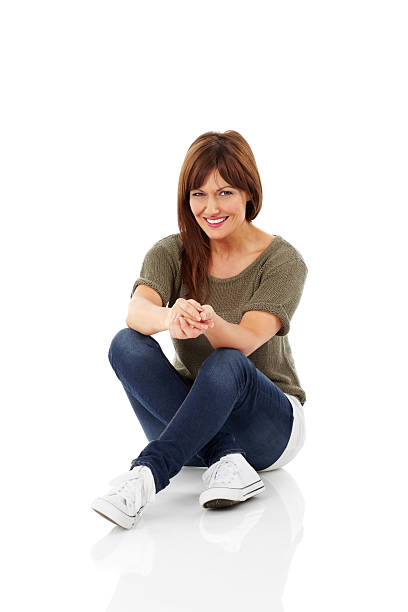 Beautiful woman sitting over white background