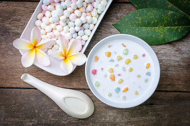 istock Colorful candies dumplings in coconut cream 512979732