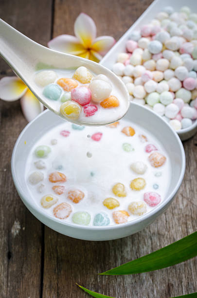 istock Colorful candies dumplings in coconut cream 512979796