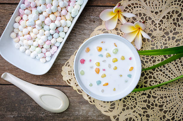 Colorful candies dumplings in coconut cream