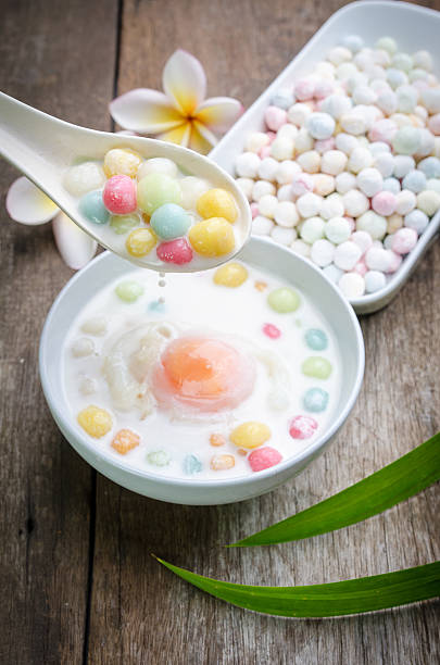 istock Colorful candies dumplings in coconut cream 512979976