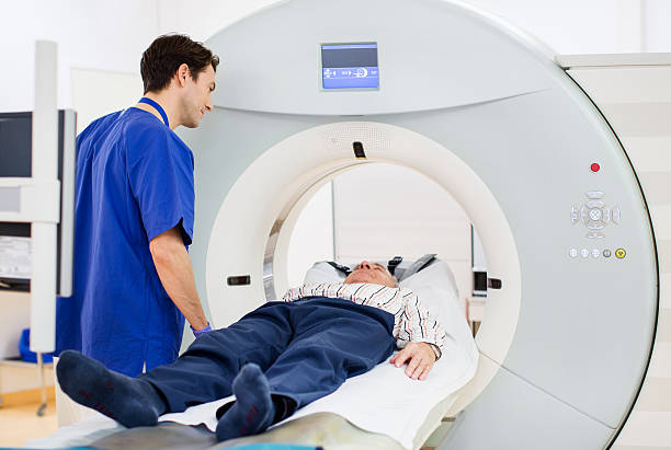 istock Patient and Doctor in CAT Scan 512980013