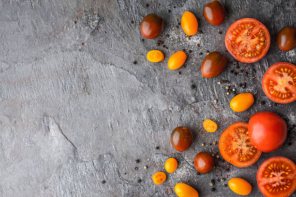istock Tomatoes mix  with salt and pepper on the stone table 512980434