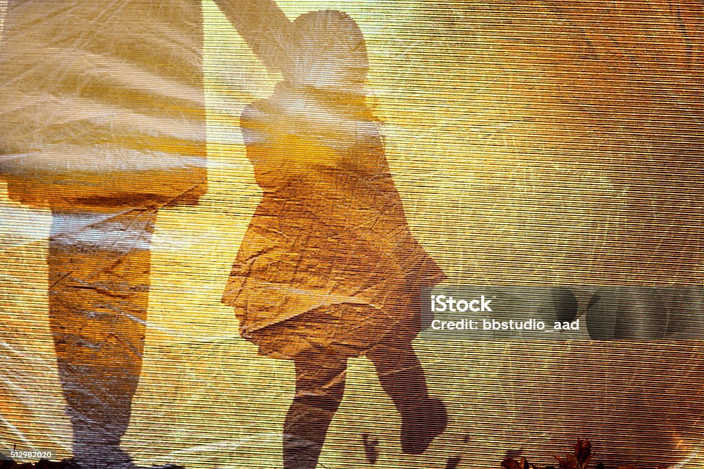 Shadow of a little girl and woman Shadow of a little girl and young woman Child Stock Photo