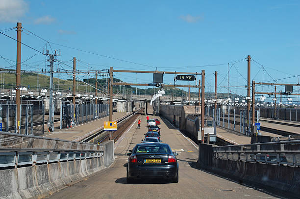 Channel tunnel Folkestone Сhannel Tunnel, England - August 3, 2013: cars about to board the train for the Channel Tunnel crossing from England, UK. High speed eurostar trains carry vehicles between England and France. Eurostar stock pictures, royalty-free photos & images