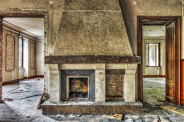 Fireplace in an abandoned manor stock photo