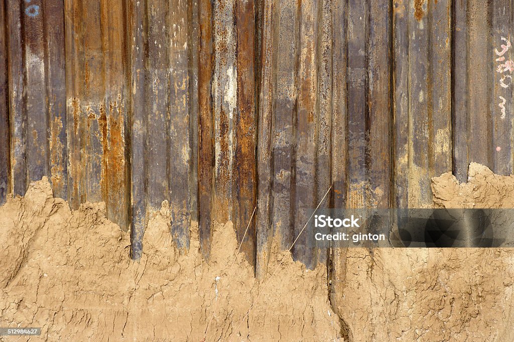 Rusted steel wall The photograph of a rusty steel wall at a construction site. Trench Stock Photo