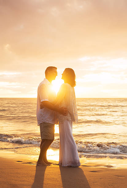 istock Mature Couple Kissing at Sunset 512985043