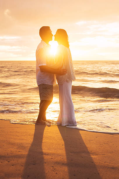 istock Mature Couple Kissing at Sunset 512985055
