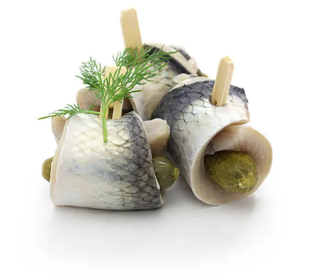 homemade rollmops, rolled pickled herring fillets