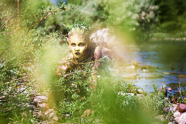 Water Nymph slowly crawling out of shallow river. Photographed through reeds.