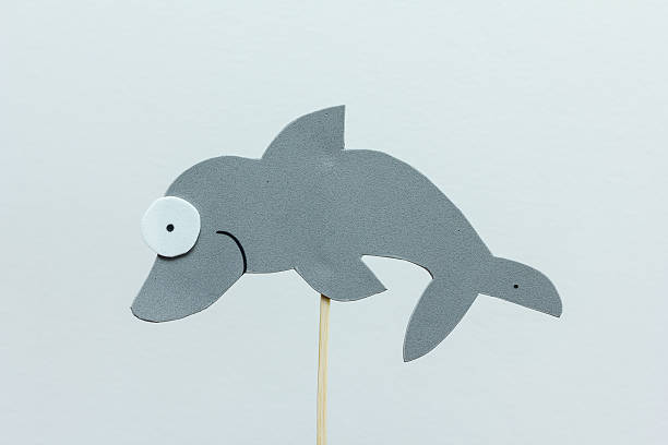 istock eva foam gray dolphin on white background 512986092