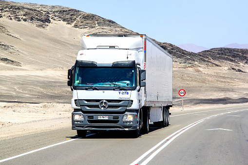 Atacama, Chile - November 14, 2015: Semi-trailer truck Mercedes-Benz Actros drives at the interurban freeway through the Atacama desert.