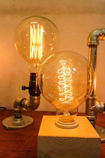 istock Close up light bulb decoration in wooden table 512986632