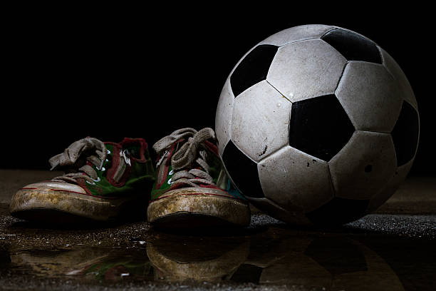 Brudne buty z Piłka nożna – zdjęcie