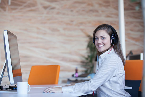 istock secretary with headphones 512989604