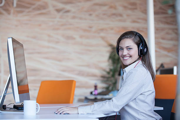istock secretary with headphones 512989816
