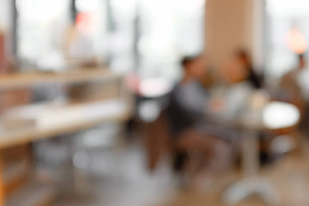 istock Defocused cafeteria background with people and daylight 512990526