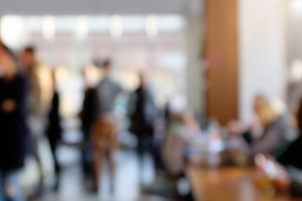 istock Defocused cafeteria background with people and daylight 512990544