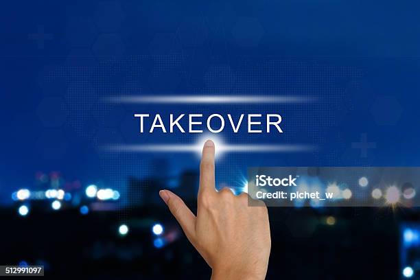 Hand Pushing Acquisition Takeover Button On Touch Screen Stock Photo - Download Image Now