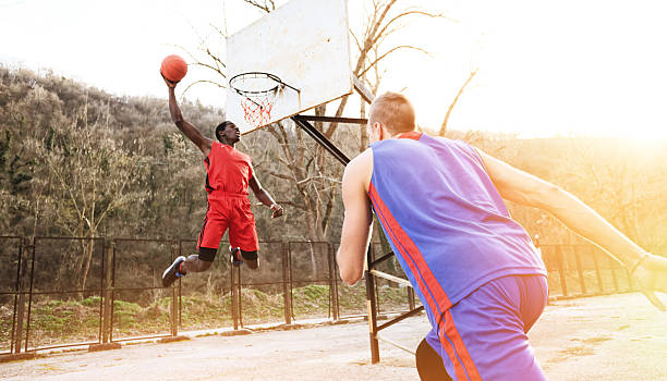 istock Basketball Slam Dunk Jump as background 512991790