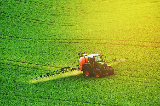istock Farm machinery spraying insecticide 512993322