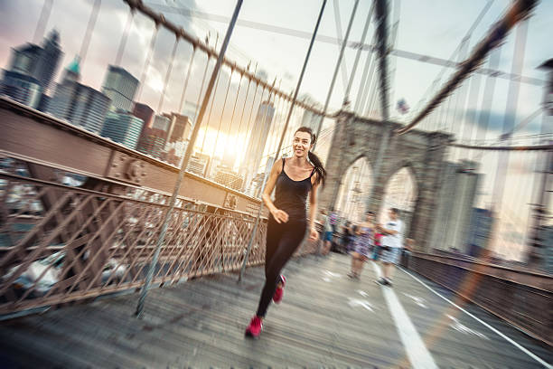istock Woman running on the Brooklyn Bridge 512993465