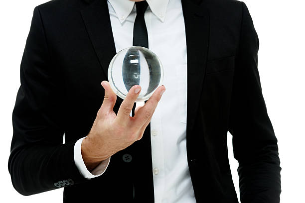 istock Businessman holding crystal ball 512993727