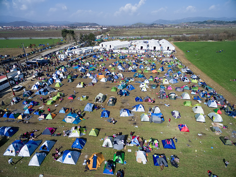Idomeni, Greece - March 1, 2016: Thousands of immigrants are in a wait at the border between Greece and FYROM waiting to cross the borders to FYR of Macedonia. Aerial shot with drone