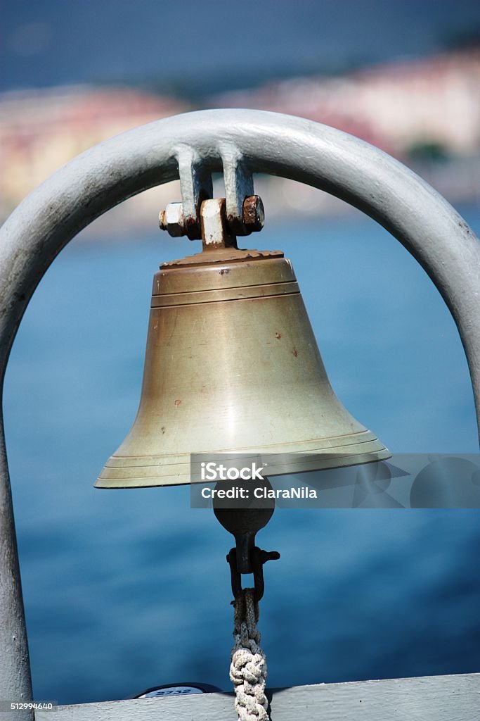 Golden ship's bell aboard Bell Stock Photo