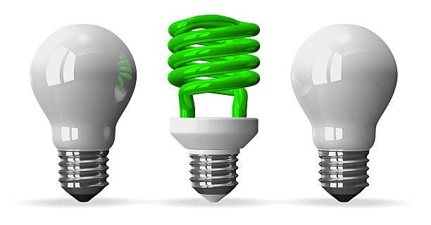 istock Green spiral light bulb and two white tungsten ones 512995151
