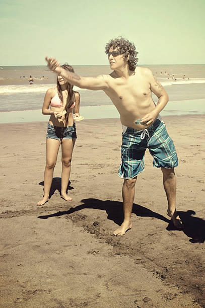 istock Father and daughter playing in the beach 512995526