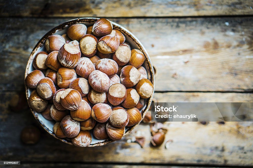 Hazelnuts on rustic wooden background Hazelnut Stock Photo