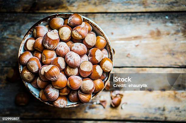 Hazelnuts On Rustic Wooden Background Stock Photo - Download Image Now - Hazelnut, Brown, Close-up