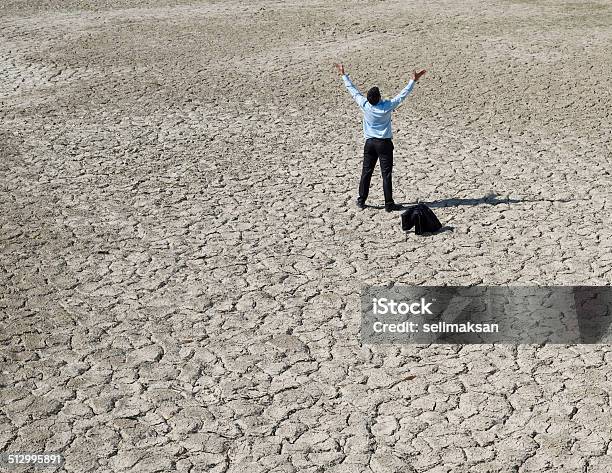 Lost Businessman In Desert Looking For Help Stock Photo - Download Image Now - Crisis, Desert Area, Environment