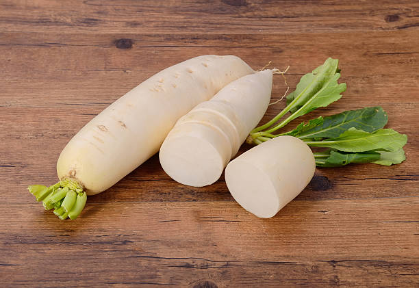 istock Daikon radish on the wood background 512996223