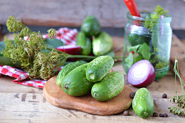 istock Set for home canning cucumbers on a background of onion 512997261