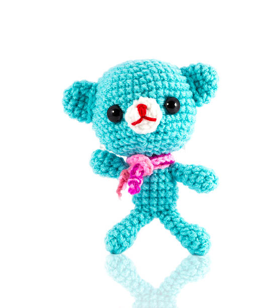 istock handmade crochet blue bear doll on white background 513000371