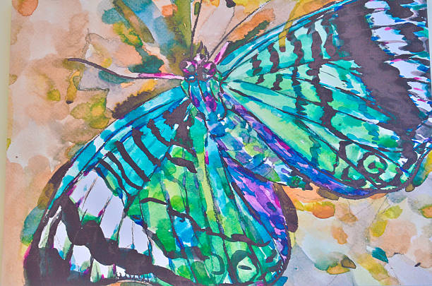 istock Watercolor butterfly on old paper background 513000979