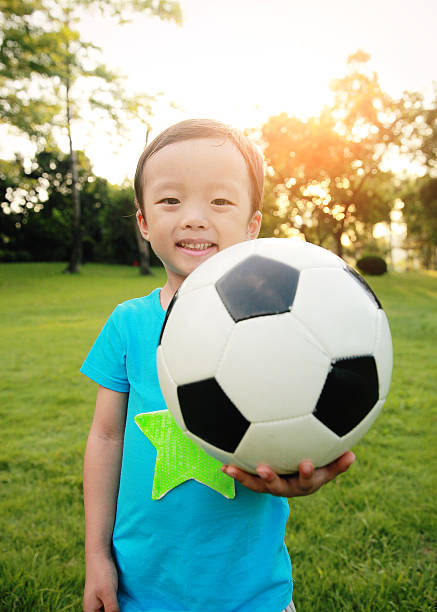 istock Boy with soccer ball 513019215