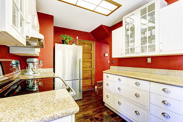 istock White kitchen room with contrast bright red walls 513022181