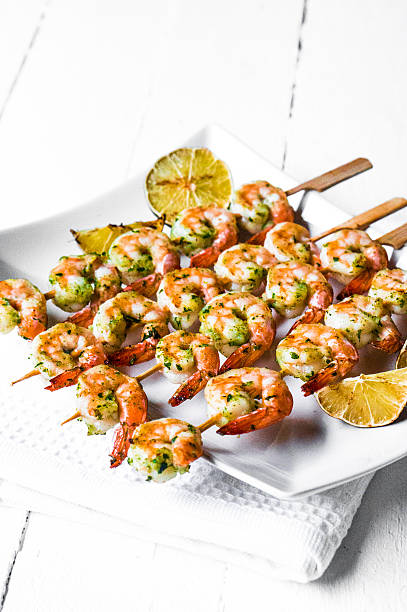 istock Grilled shrimps with limes 513024091