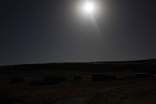 Wahiba Sands desert at night. Magical scenery trough dunes and moonlight