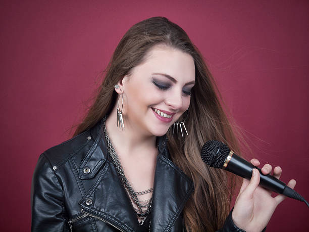 istock Pretty girl with micropphone 513024611