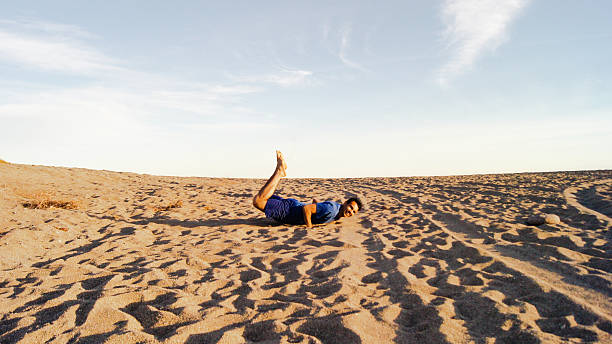 istock Man falling on the beach in a sunny day 513041152