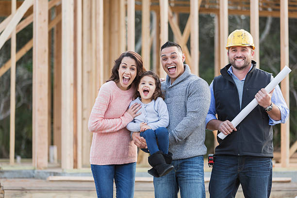 istock Hispanic family building a new home, with contractor 513042914
