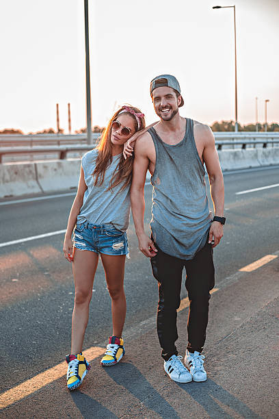 Couple standing on the road stock photo