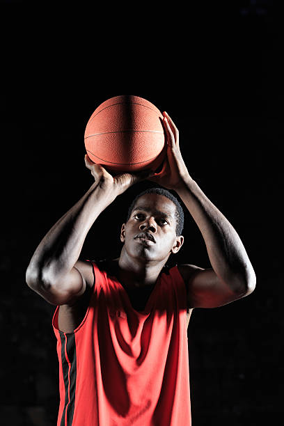 istock African player throwing basketball 513046678