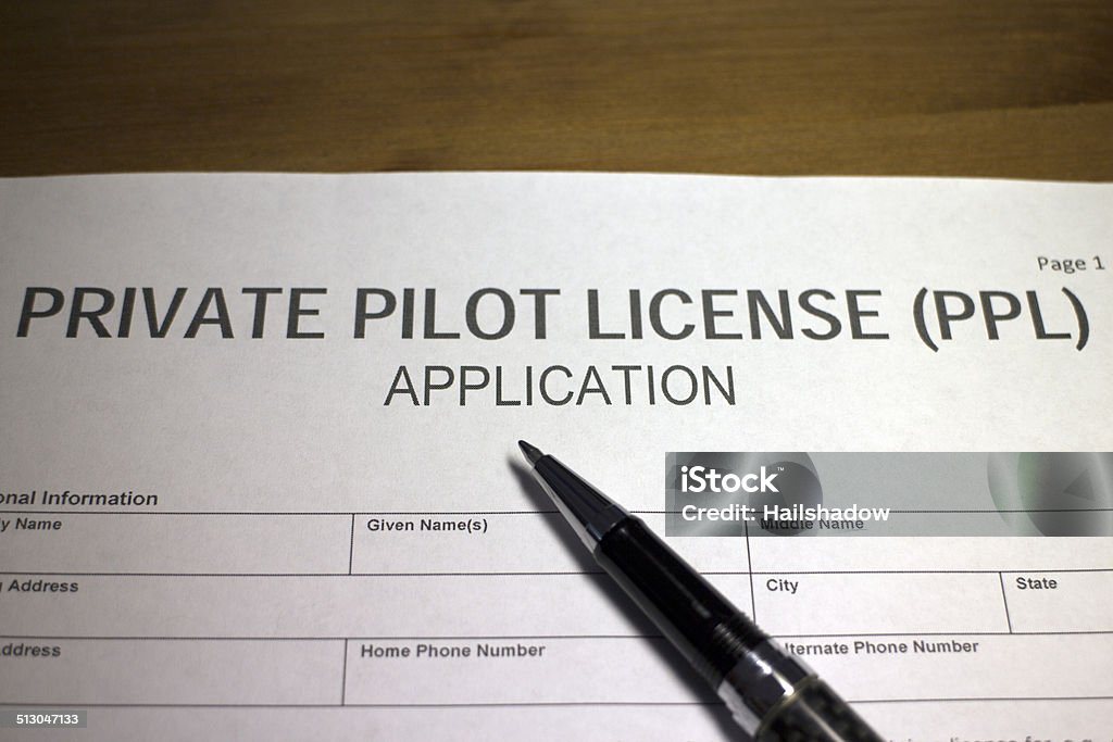 Pilot License Application Someone filling out Private Pilot License (PPL) Application Form. Pilot Stock Photo